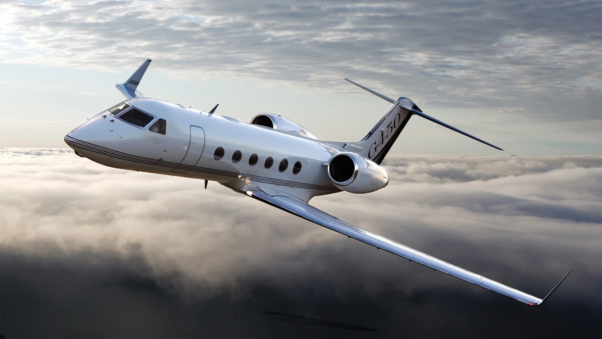 Gulfstream G450 flying over the clouds