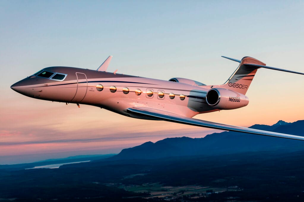 Gulfstream G650ER flying over the mountains