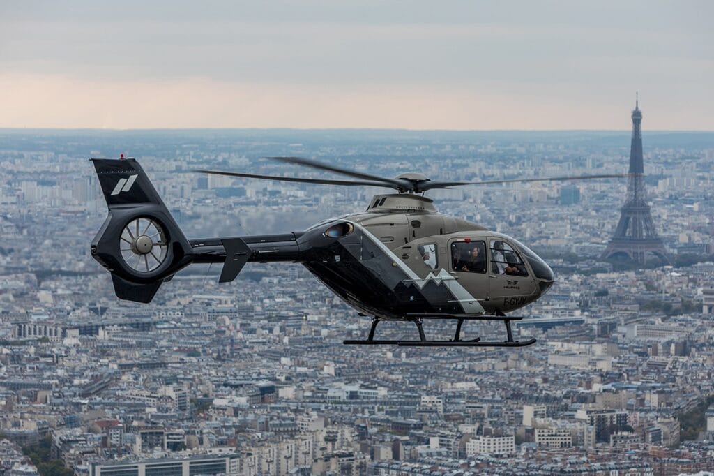 helicopter ride from Paris to Le Mans with Eiffel tower view